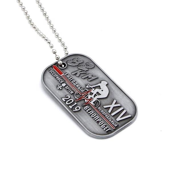 Antique dog tag with custom enamel logo engraved